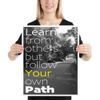 Black and White photo of roadway integrated with white and yellow text