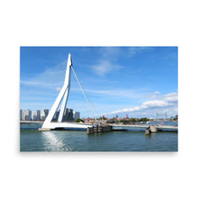 Load image into Gallery viewer, Modern bridge over water with a clear blue sky
