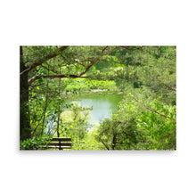 Load image into Gallery viewer, Wooden bench in a serene forest setting with a lake
