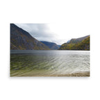 Lake surrounded by mountains on a cloudy day