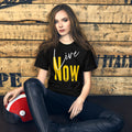 The word ' Now ' in huge yellow gold type combined with the word ' Live ' in white script style type