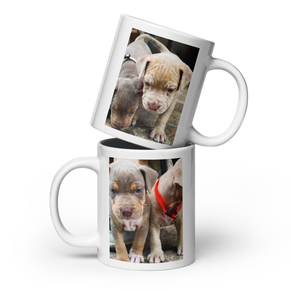 A White ceramic mug with a cute photo of 2 puppies printed on each side