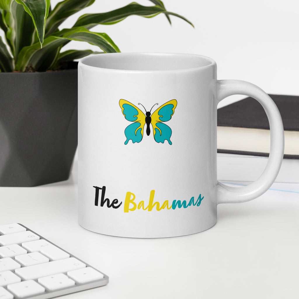 White mug with butterfly design and 'The Bahamas' text in Bahamian flag colors