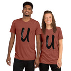 Large letter U in bold, black type with the word Believe in white type placed vertically inside