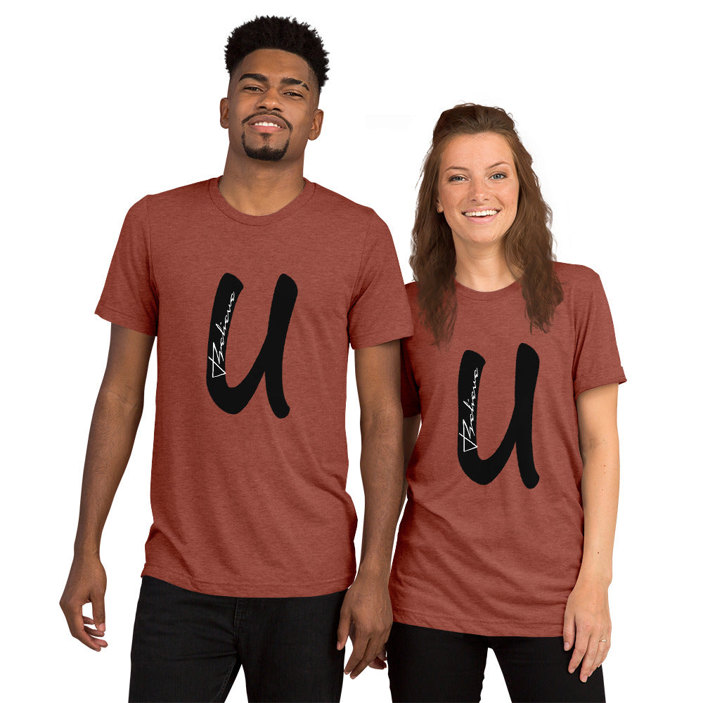 Large letter U in bold, black type with the word Believe in white type placed vertically inside